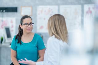 photo of Doctor speaking to Patient